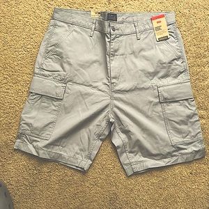 Never worn, still tagged 38 waist bright gray cargo shorts.